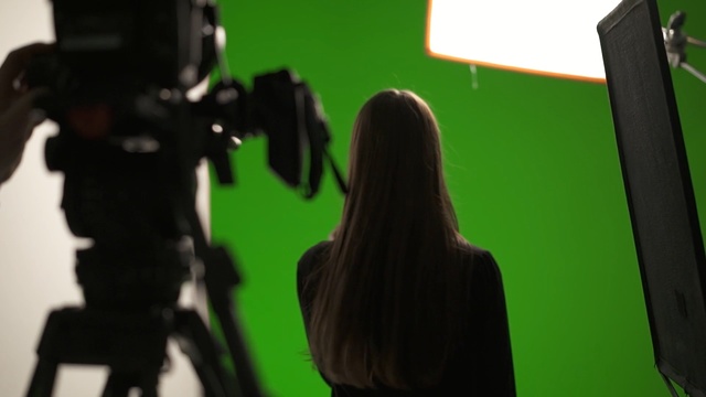 Video Reference: Green, Filmmaking, Camera operator, Videographer, Firearm, Fictional character, Shadow, Film studio, Cinematographer, Gun, Person