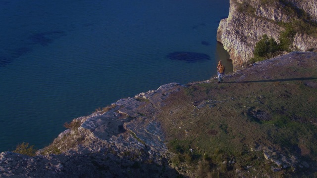 Video Reference: Cliff, Klippe, Sky, Rock, Sea, Promontory, Terrain, Coast, Mountain, Cape