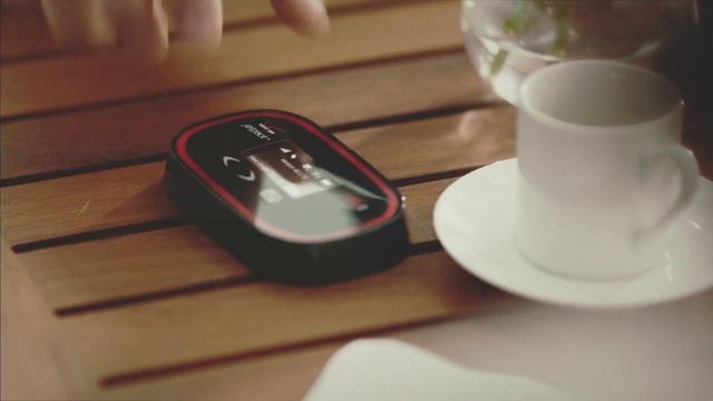 Video Reference: Cup, Coffee cup, Technology, Cup, Electronic device, Wood, Finger, Table, Drink, Hand