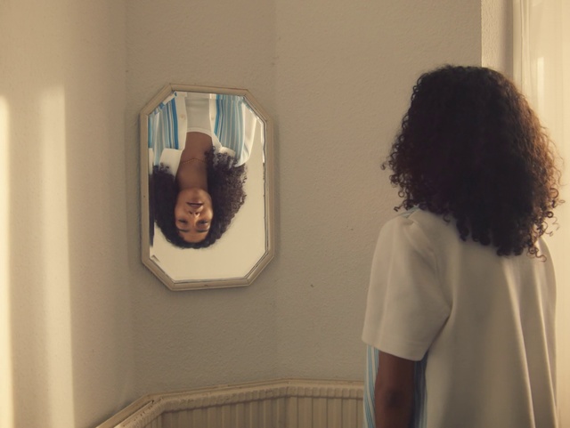 Video Reference: Wall, Shoulder, Room, Mirror, Art, Long hair, Visual arts, Window, Interior design, House
