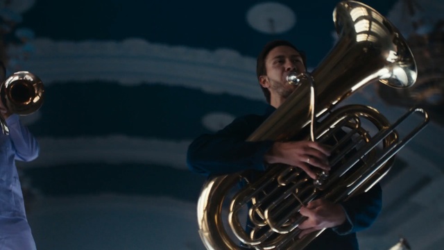 Video Reference: brass instrument, musical instrument, tuba, euphonium, wind instrument, trumpet, saxhorn, musician, saxophonist, cornet, Person