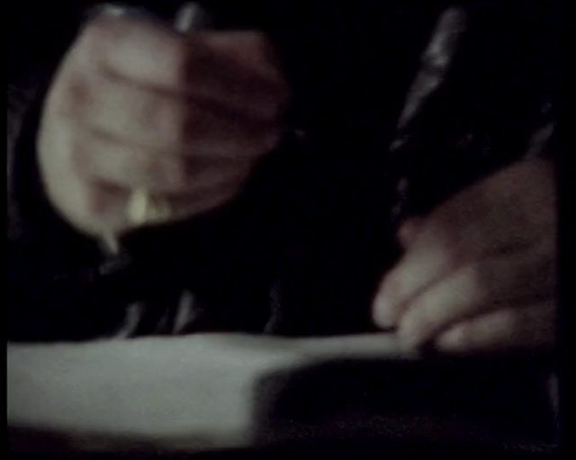 Video Reference: face, black, finger, man, darkness, hand, head, night, light, mouth, Person