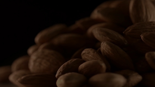 Video Reference: pistachio, nut, edible nut, seed, fruit, brown, food, peanut, close, ingredient, Person