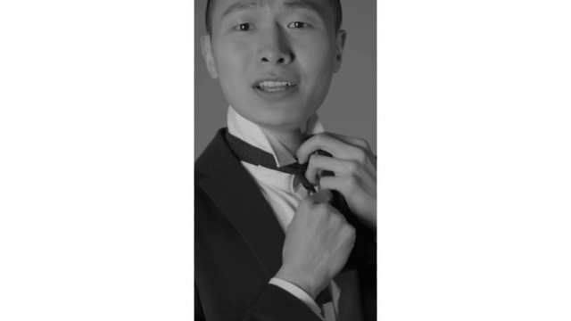 Video Reference: Photograph, Suit, Formal wear, Snapshot, Tuxedo, Portrait, Black-and-white, Tie, Photography, Gesture