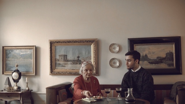 Video Reference: room, interior design, home, house, window, painting, furniture, picture frame, decor, table, Person