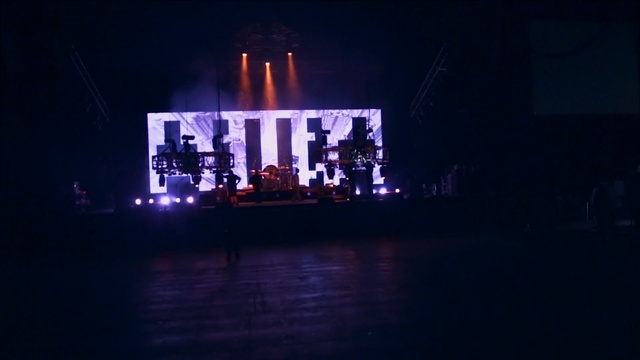 Video Reference: Stage, Light, Lighting, Performance, Purple, Darkness, Night, Performing arts, Music venue, Sky, Person