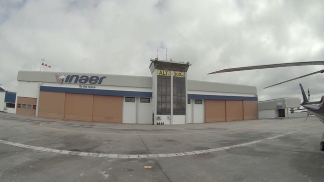 Video Reference: property, mode of transport, infrastructure, structure, asphalt, hangar, sky, real estate, building, airport