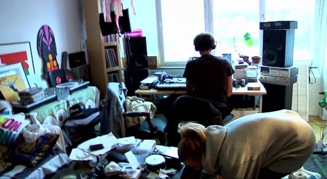 Video Reference: Room, Furniture, Sitting, Chair, Interior design, Photography, Conversation, Living room, Building, Black hair