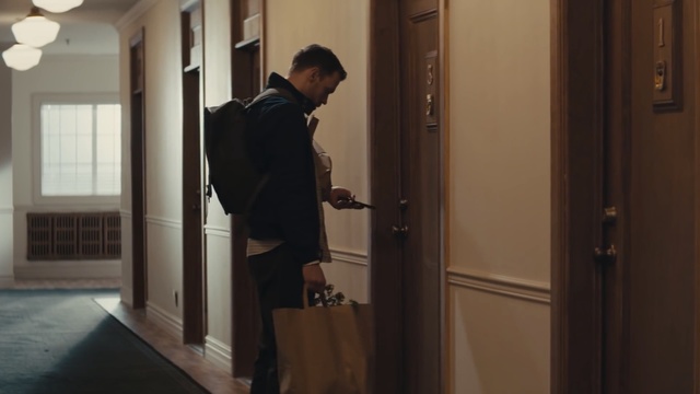 Video Reference: room, standing, suit, door, girl, Person