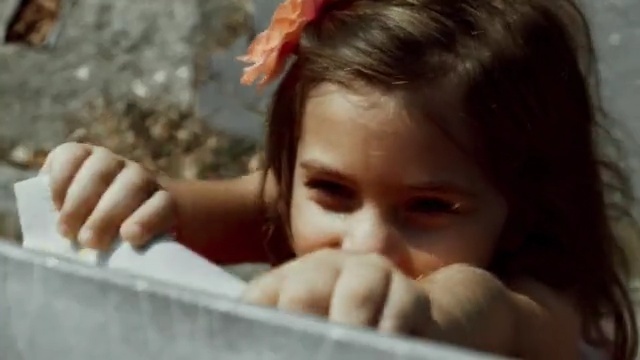 Video Reference: face, facial expression, nose, human hair color, child, head, cheek, forehead, girl, eye, Person