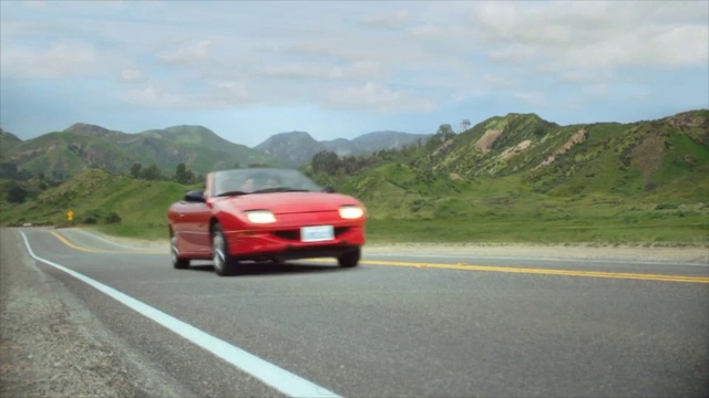 Video Reference: Land vehicle, Vehicle, Car, Coupé, Automotive exterior, Sedan, Road, Asphalt, Sports car, Road trip