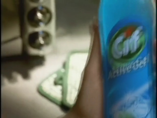 Video Reference: blue, green, skin, finger, product, hand, bottle, close up, plastic bottle, arm, Person