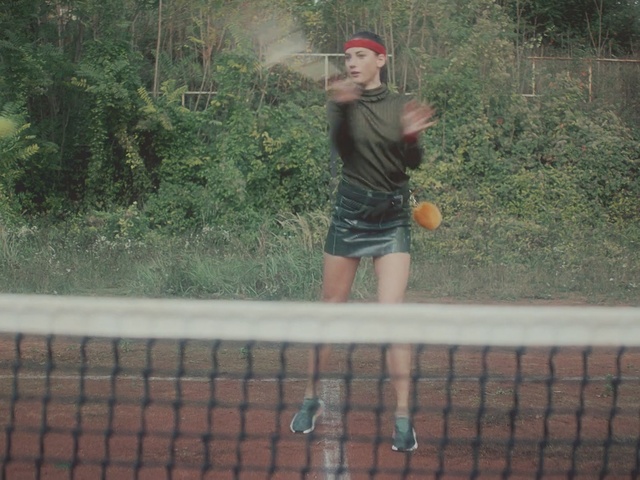 Video Reference: net, tree, water, plant, grass, tennis, fun, racquet sport, girl, vacation, Person