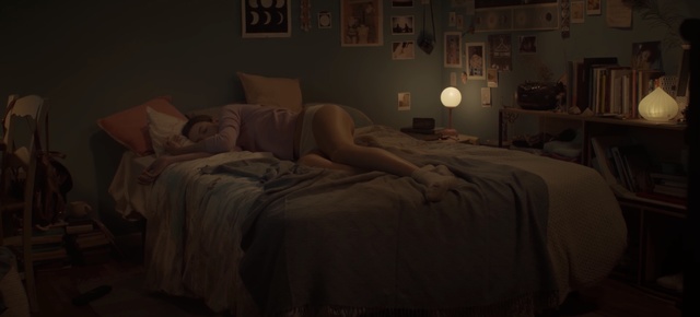 Video Reference: room, bedroom, furniture, bed, light, wall, lighting, interior design, home, textile, Person