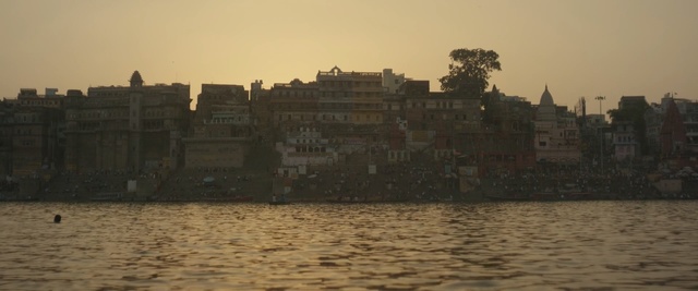 Video Reference: body of water, water, waterway, sky, reflection, sea, city, evening, sunset, river