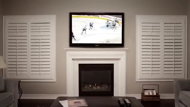 Video Reference: room, interior design, living room, wall, hearth, home, window covering, window, fireplace, flat panel display