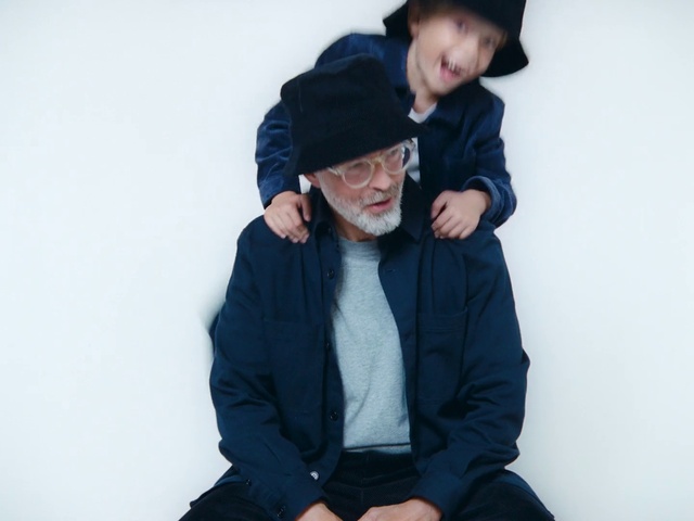 Video Reference: Blue, Outerwear, Headgear, Cool, Photography, Sitting, Smile, Hoodie, Jacket, Black hair