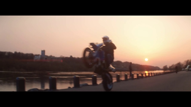 Video Reference: Stunt performer, Motorcycle, Stunt, Morning, Photography, Vehicle, Extreme sport, Sky, Sunlight, Fun