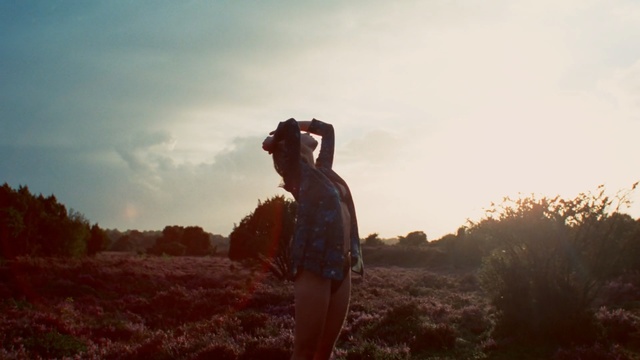 Video Reference: sky, girl, cloud, photography, sunlight, grass, tree, morning, hill, ecoregion, Person