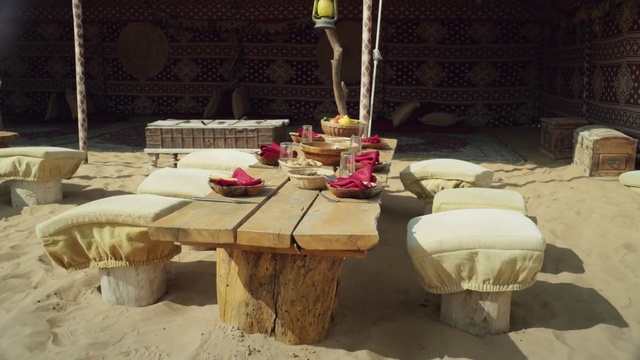 Video Reference: Table, Furniture, Coffee table, Outdoor table, Centrepiece, Chair, Interior design, Room, Tablecloth