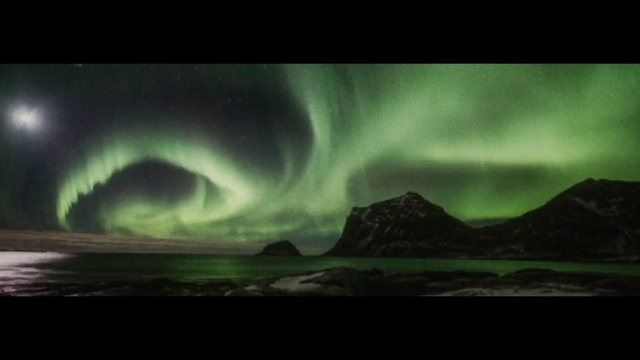 Video Reference: Nature, Aurora, Sky, Atmosphere, Geological phenomenon, Darkness, Space, Landscape, Stock photography, Wave, Sitting, Table, Green, Cake, Water, White, Room, Mountain, Cloud, Night sky