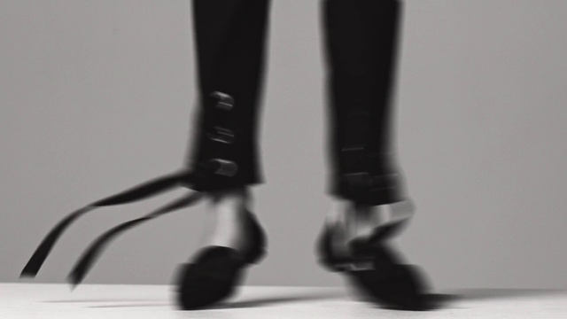 Video Reference: Footwear, Leg, Tights, High heels, Shoe, Material property, Thigh, Boot, Ankle, Human leg, Indoor, Table, Sitting, Front, Shoes, Black, White, Feet, Standing, Small, Pair, Cat, Mirror, Close, Desk, Glass, Computer, Wine, Riding, Red, Vase, Man, Black and white, Sports equipment, Joint