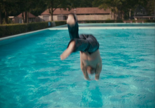 Video Reference: Swimming pool, Water, Leisure, Fun, Aqua, Recreation, Swimming, Summer, Vacation, Leisure centre, Pool, Sport, Outdoor, Blue, Frisbee, Young, Playing, Man, Woman, Large, Game, Body, Standing, Holding, Board, White, Ball, Riding, Catch, Doing, Ocean, Water sport