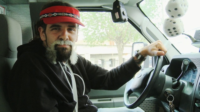 Video Reference: car, facial hair, motor vehicle, vehicle, technology, beard, automotive design, city car, driving, automotive exterior, Person