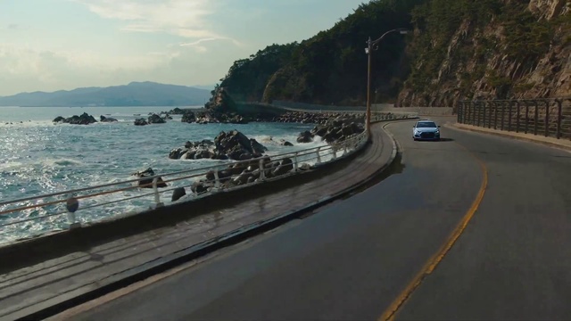 Video Reference: Road, Highway, Coast, Mode of transport, Sea, Infrastructure, Sky, Guard rail, Thoroughfare, Shore