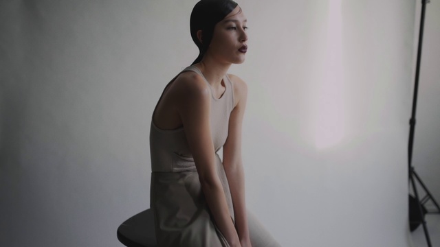 Video Reference: Shoulder, Skin, Standing, Sitting, Joint, Photography, Hand, Neck, Headgear, Dress