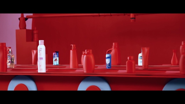 Video Reference: Red, Person, Shelf, Sitting, Table, Orange, Small, Display, Large, Man, Counter, Truck, Holding, White, Woman, Standing, Room, Pink, Bottle, Soft drink, Drink, Cup