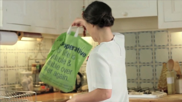 Video Reference: woman, kitchen, food, package, bag , Person