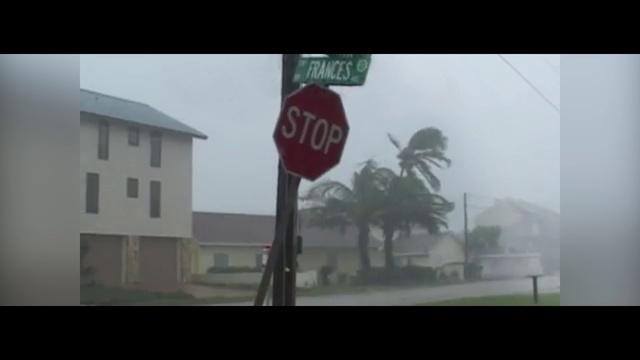Video Reference: Atmospheric phenomenon, Stop sign, Traffic sign, Signage, Mode of transport, Street sign, Sign, Tree, Font, House