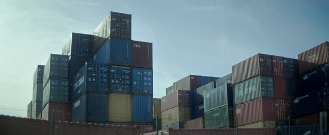 Video Reference: architecture, skyscraper, building, city, office, urban, modern, sky, glass, container ship, downtown, tower, business, window, construction, cargo ship, corporate, cityscape, buildings, tall, exterior, ship, structure, high, business district, Person