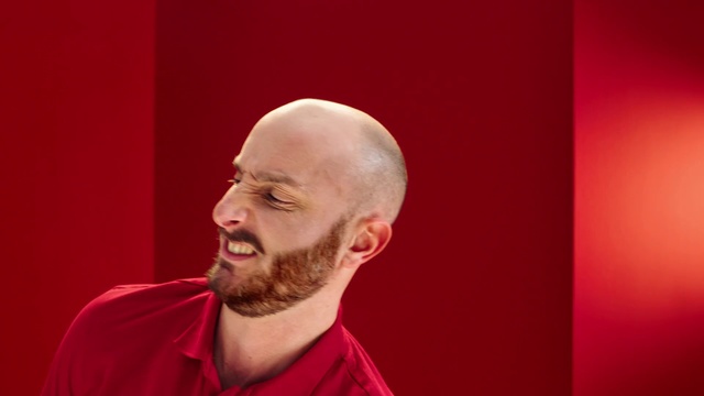Video Reference: Red, Facial hair, Head, Chin, Beard, Cheek, Forehead, Human, Smile, Singer