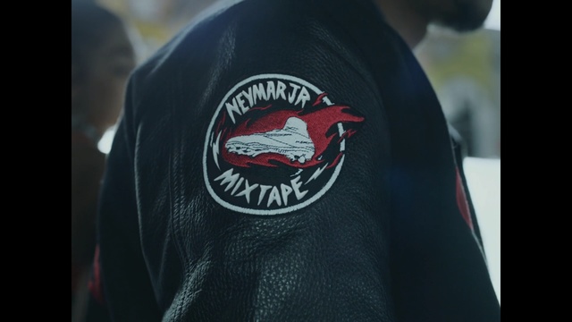 Video Reference: T-shirt, Clothing, Jacket, Top, Outerwear, Sleeve, Shirt, Cap, Emblem