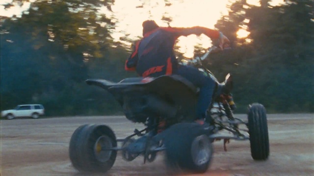 Video Reference: Land vehicle, Vehicle, All-terrain vehicle, Car, Stunt performer, Motorsport, Automotive wheel system, Automotive tire, Go-kart, Sports, Person