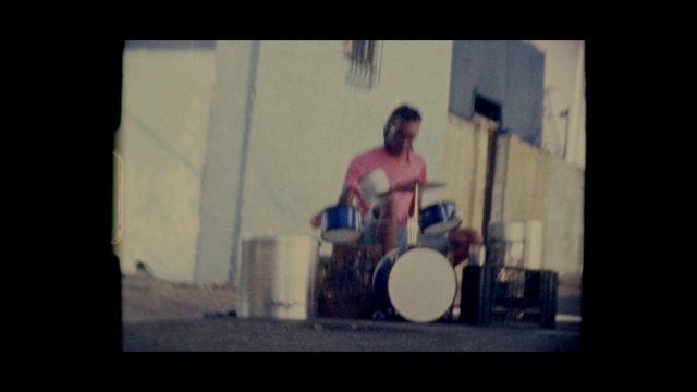 Video Reference: musical instrument, snapshot, drums, music, performance art, drum, audio, musician, darkness, performance, Person