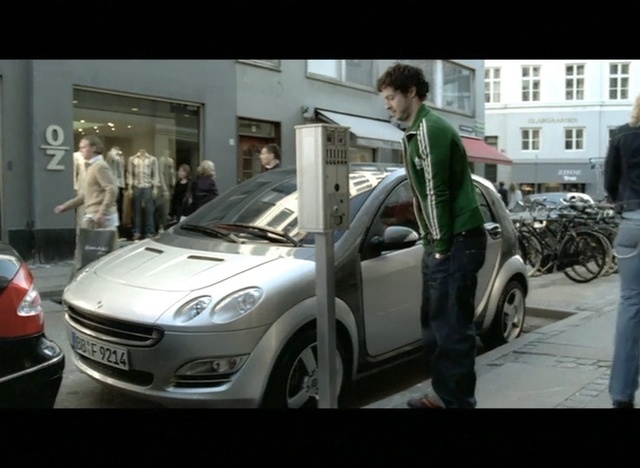 Video Reference: Land vehicle, Vehicle, Car, Automotive design, City car, Hatchback, Supermini, Bumper, Compact car, Person