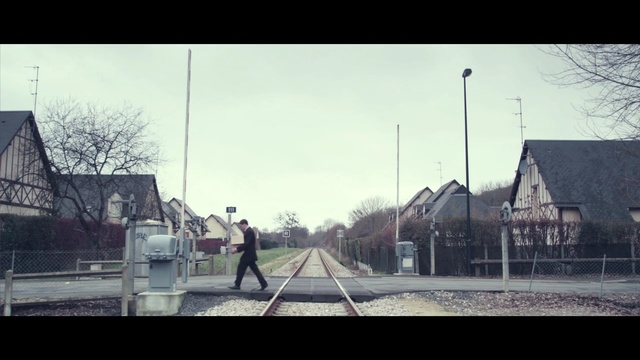 Video Reference: track, sky, transport, town, urban area, residential area, tree, morning, atmosphere, rail transport