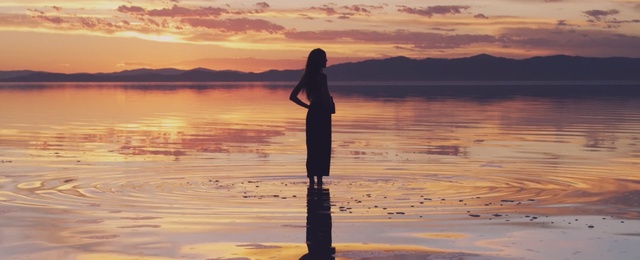 Video Reference: reflection, sky, calm, sunrise, horizon, morning, shore, sunset, sea, water, Person