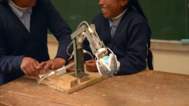 Video Reference: school, science, experiment, friends, friend, girl, black girl, hands, classroom, room, physics, Person