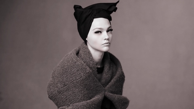 Video Reference: Clothing, Fashion, Headgear, Lip, Wool, Outerwear, Photography, Ear, Portrait, Black-and-white, Person