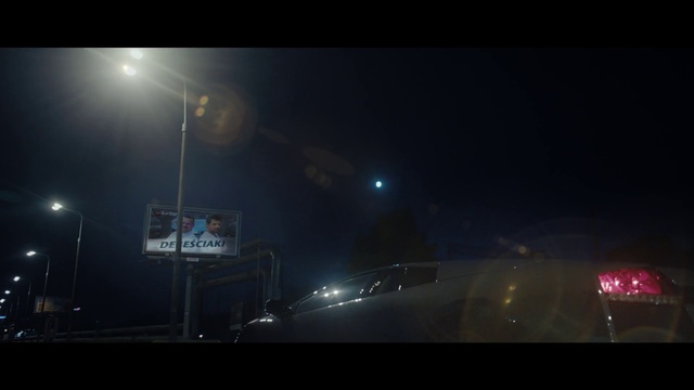 Video Reference: Sky, Atmosphere, Night, Light, Darkness, Lens flare, Lighting, Street light, Atmospheric phenomenon, Midnight, Outdoor, Street, Traffic, Sign, Sitting, Stop, City, Fireworks, Large, Red, Station, White, Parked, Snow, Standing, Screenshot, Fog, Night sky