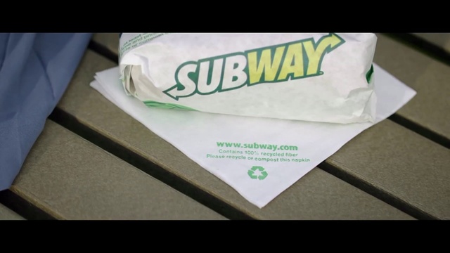 Video Reference: Green, Text, T-shirt, Font, Sportswear, Brand, Label, Paper, Paper product, Sleeve