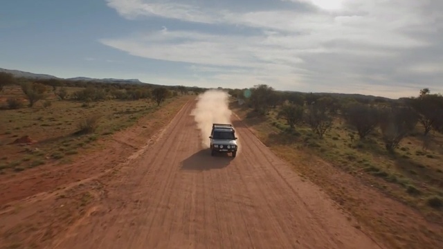 Video Reference: Dirt road, Road, Natural environment, Ecoregion, Off-roading, Infrastructure, Vehicle, Plain, Thoroughfare, Off-road vehicle