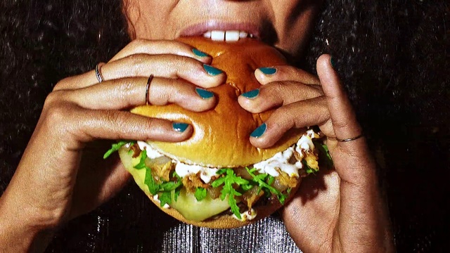 Video Reference: Junk food, Fast food, Eating, Hamburger, Food, Veggie burger, Dish, Finger food, Meal, Hand