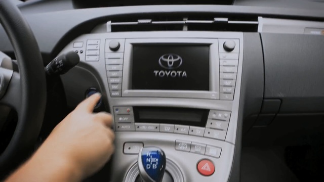 Video Reference: car, vehicle, technology, automotive design, center console, toyota, electronics, steering wheel, hardware, family car, Person