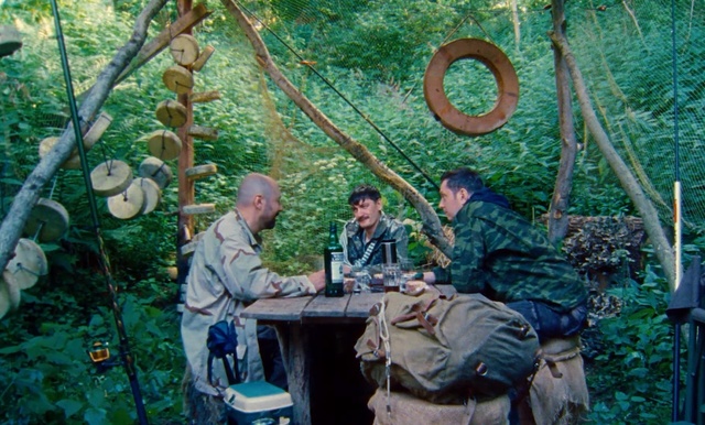 Video Reference: Jungle, Tree, Adaptation, Forest, Plant, Woodland, Outdoor, Person, Man, Sitting, Food, Table, People, Laptop, Group, Woman, Eating, Street, Bench, Fruit, Computer, Park, Bed, Young, Standing, Holding, Riding, Clothing