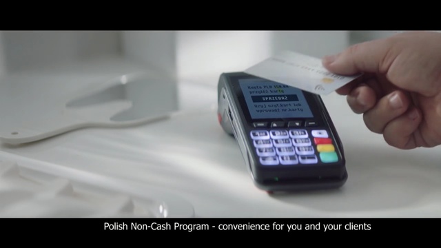 Video Reference: Office equipment, Electronic device, Gadget, Technology, Mobile phone, Calculator, Communication device, Portable communications device, Telephony, Telephone, Indoor, Person, Remote, Hand, Holding, Control, Screen, Table, Sitting, Video, White, Small, Television, Black, Phone, Monitor, Man, Close, Wii, Game, Display, Cellphone, Player, Screenshot, Text, Watch, Computer, Electronics